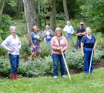 An image of Ancaster Horticultural Society members working in a garden.